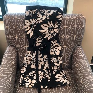 Used black and white dress does have a small stain do believe it will wash out